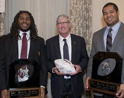 2013 Morris Trophy winners Will Sutton from ASU and Xavier Su'a Filo from UCLA with Morris Trophy board member and former UW Quarterback Tim Cowan